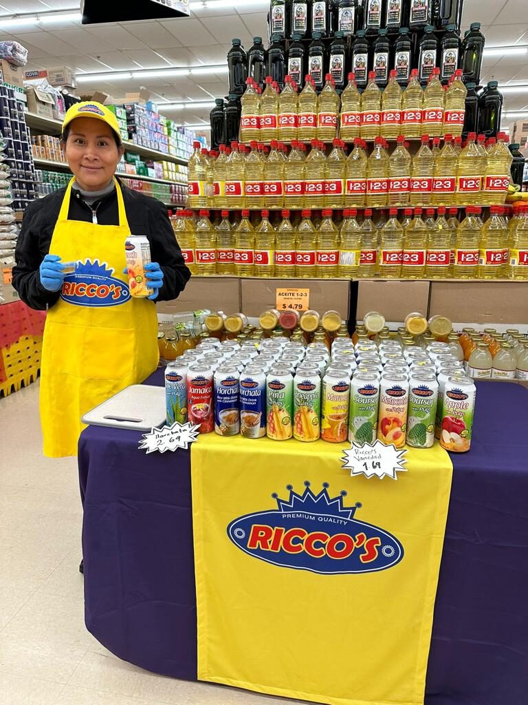 Ricco's beverage sampling display staffed by a Clip demonstrator